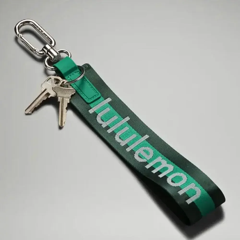 NEW Lululemon Never lost Keychain Wordmark Legacy Green/Cascadia Green/Silver